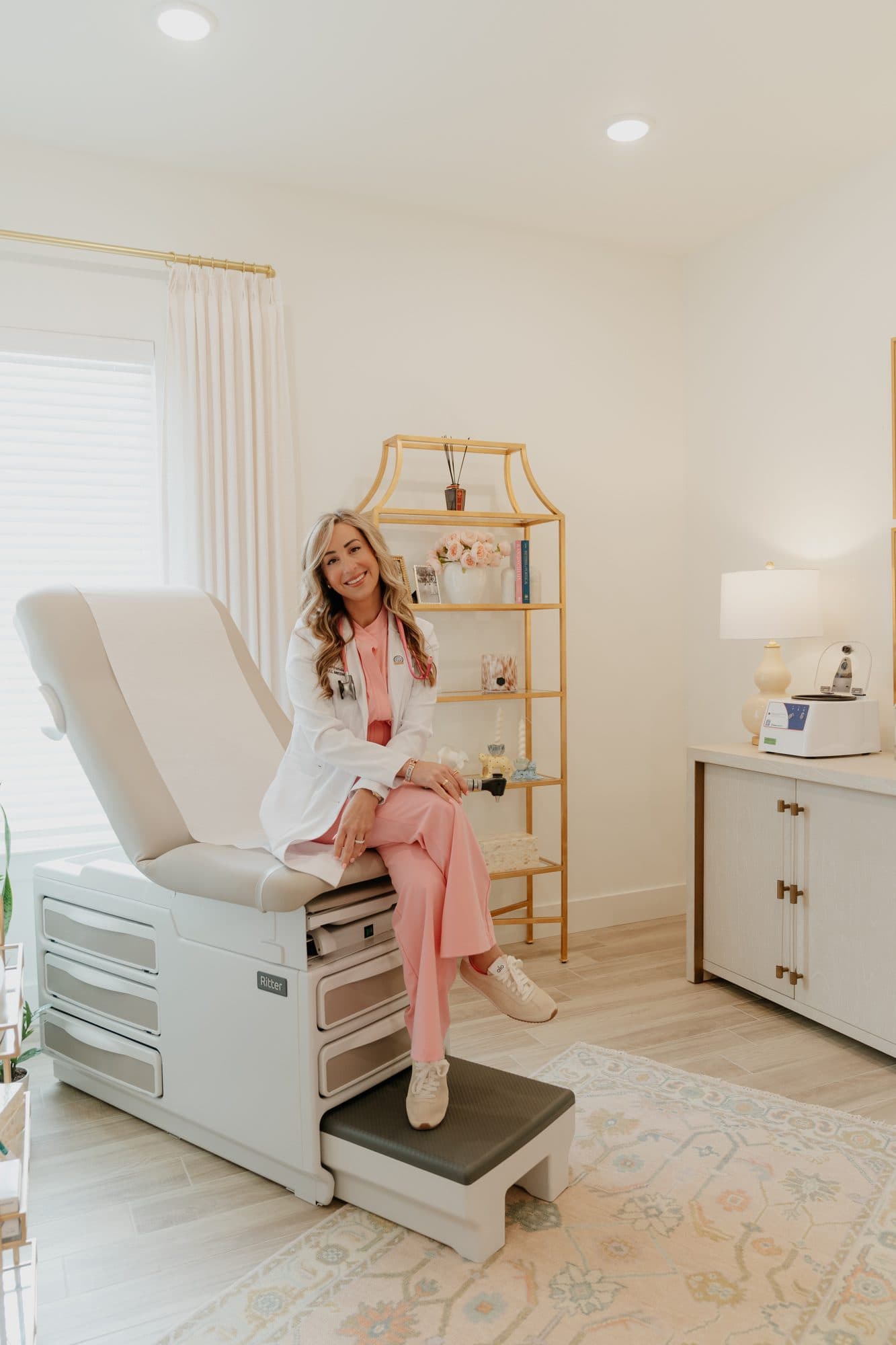 Dr. Sima Shahbandar seated in an OmriMed exam room