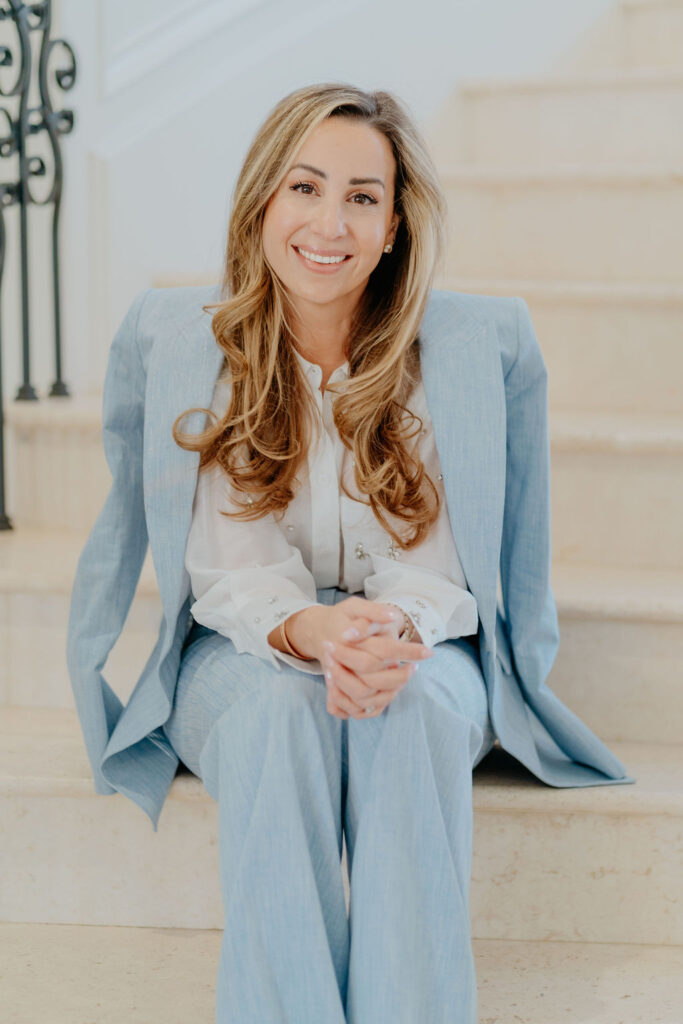 Dr. Shahbandar of Omri Med Lubbock with blue jacket over her shoulders